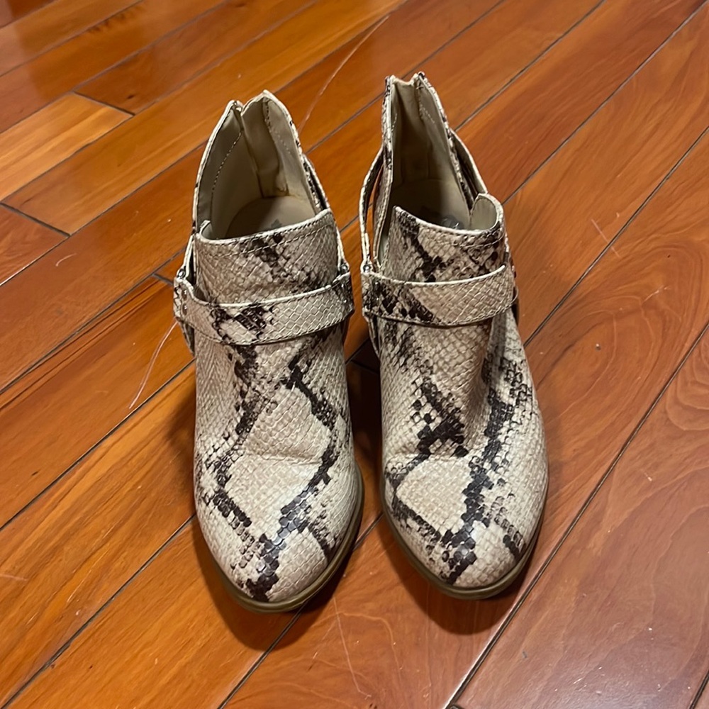 Size 7 tan and brown snake skin booties. Silver accents. Have been used